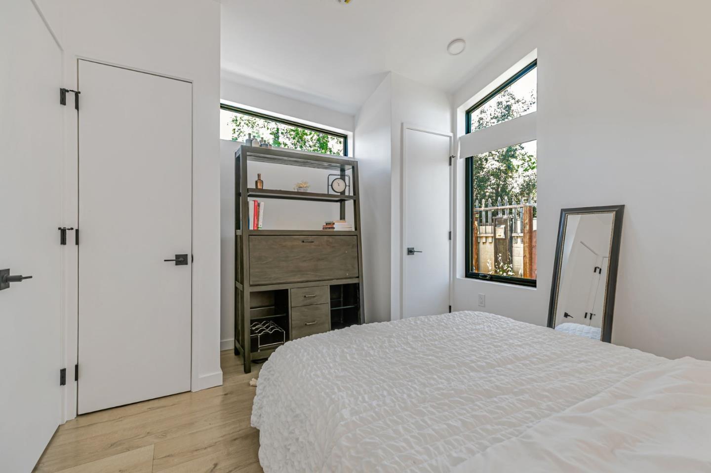 1555 Washington Street Santa Clara, CA 95050 - Photo 13 of 19 a bedroom with a bed and a fireplace