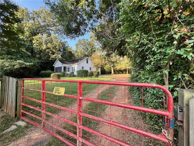 a view of small yard with wooden fence