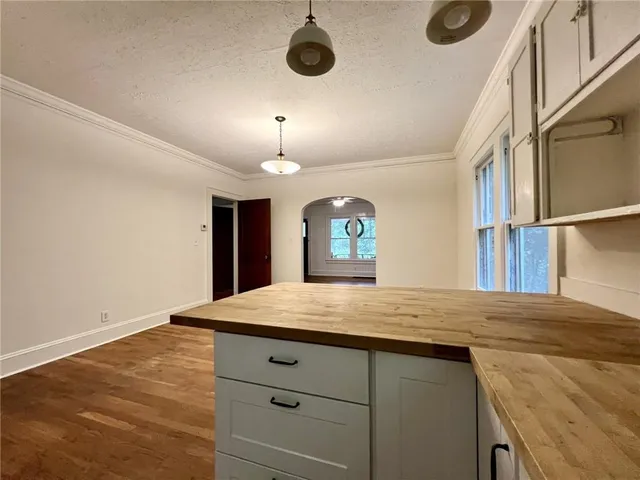a view of a kitchen cabinets and a wooden floor