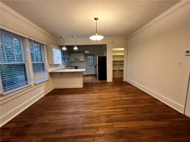 a view of a kitchen with a sink and microwave