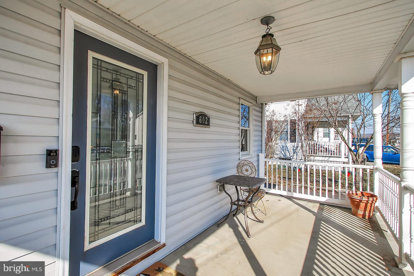 602 North Stuart Street Baltimore, MD 21221 - Photo 4 of 35 Covered Front Porch with Vinyl Rails