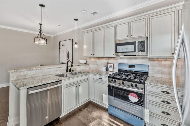 a spacious bedroom with a bed and a window