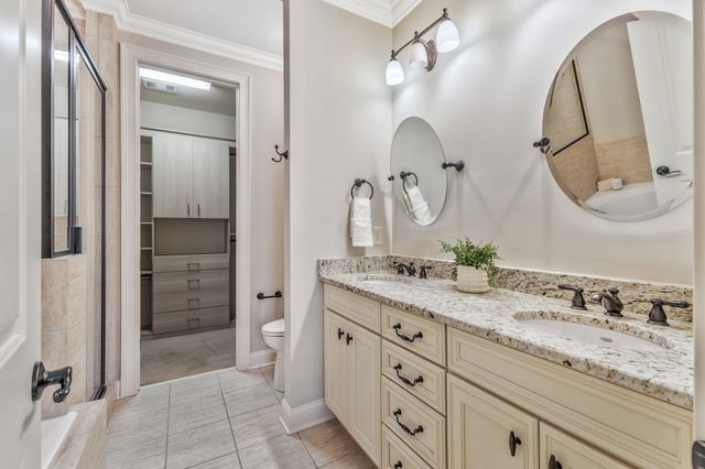 a bathroom with a tub and shower