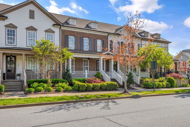 an aerial view of a house with a garden and plants