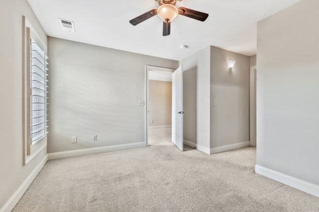 a bathroom with a sink toilet vanity and shower