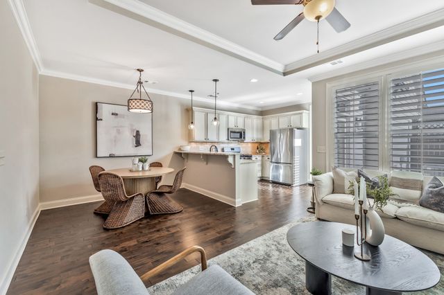 a kitchen with stainless steel appliances granite countertop a refrigerator sink and cabinets