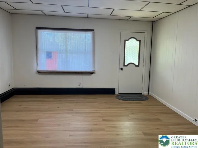 a view of an empty room with a window