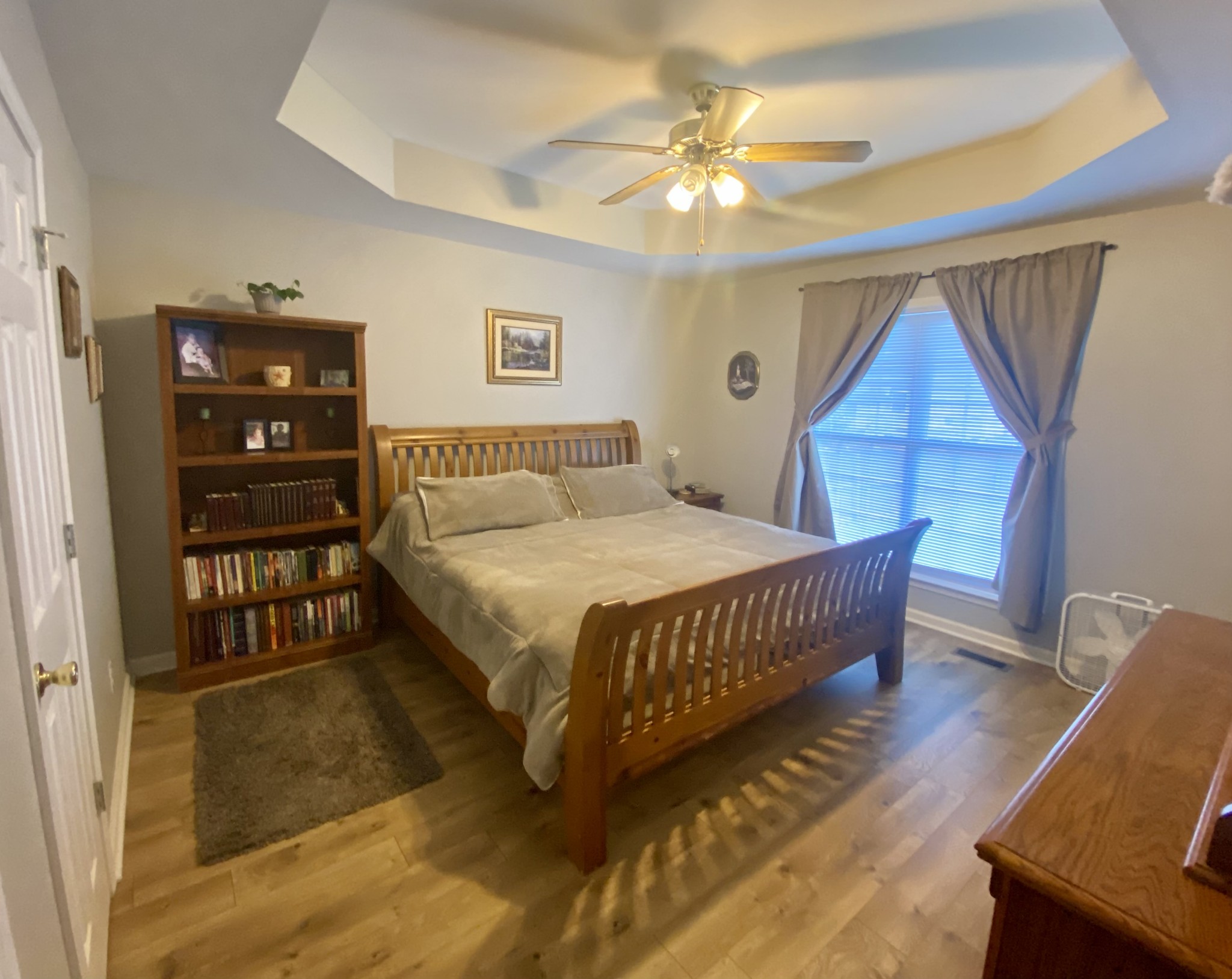 147 Filly Lane Springfield, TN 37172 - Photo 14 of 24 a bedroom with a bed a dresser and wooden floor
