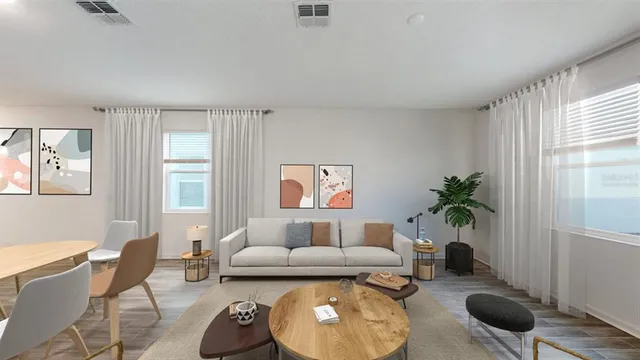 a living room with furniture rug and window