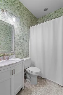 a view of a kitchen with furniture and staircase