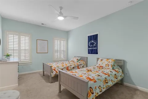 a bedroom with a bed and a dresser