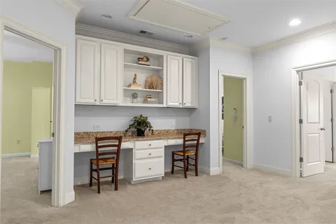 a spacious bedroom with a bed and a large window