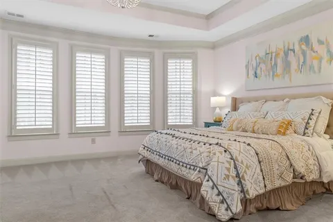 a bathroom with a granite countertop sink a mirror and shower