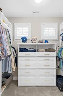 a kitchen with granite countertop a sink and a wooden cabinets