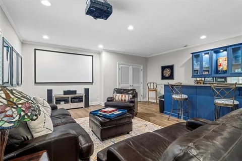 a kitchen with granite countertop lots of wooden cabinets a sink a stove and appliances