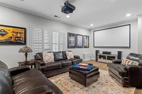 a living room with furniture or couch and a dresser