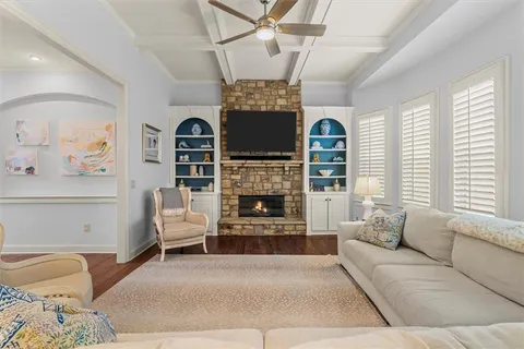 a kitchen with kitchen island granite countertop a sink appliances cabinets and counter space