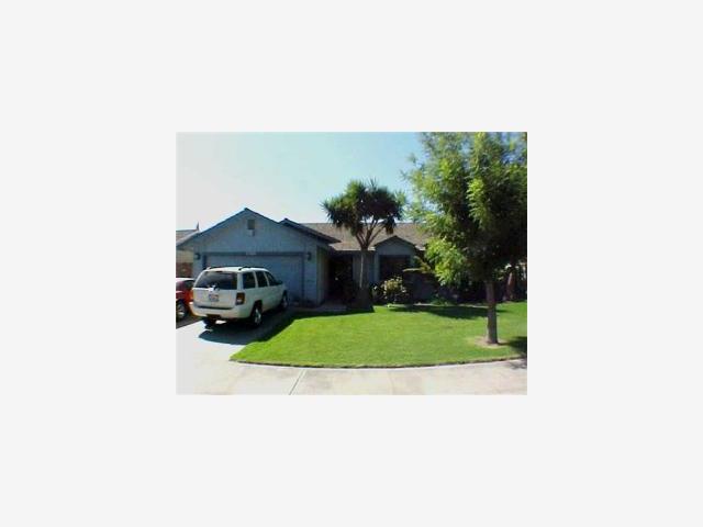 2260 Roth Way Turlock, CA 95380 - Photo 1 of 8 a picture of a person on a street