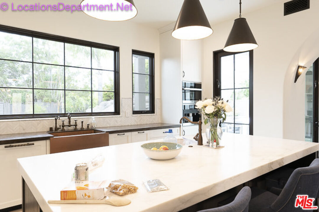 5861 Ridgebrook Drive Agoura Hills, CA 91301 - Photo 12 of 42 a kitchen with a table chairs and a window