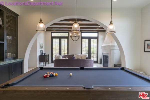 a view of room with window and air hockey table