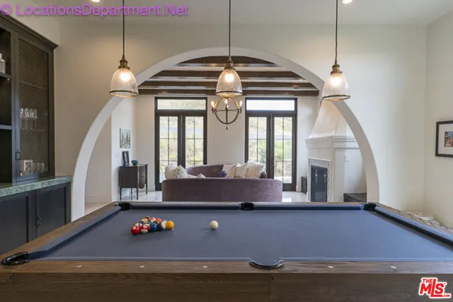 a view of room with window and air hockey table