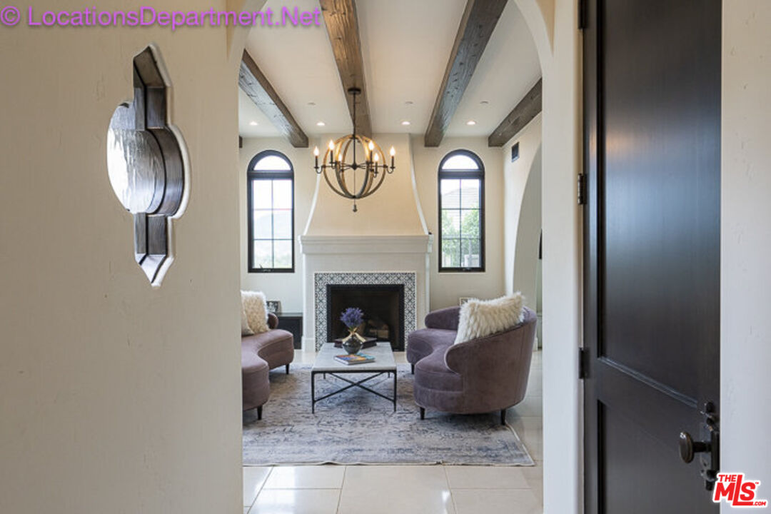 5861 Ridgebrook Drive Agoura Hills, CA 91301 - Photo 15 of 42 a living room with furniture and a fireplace
