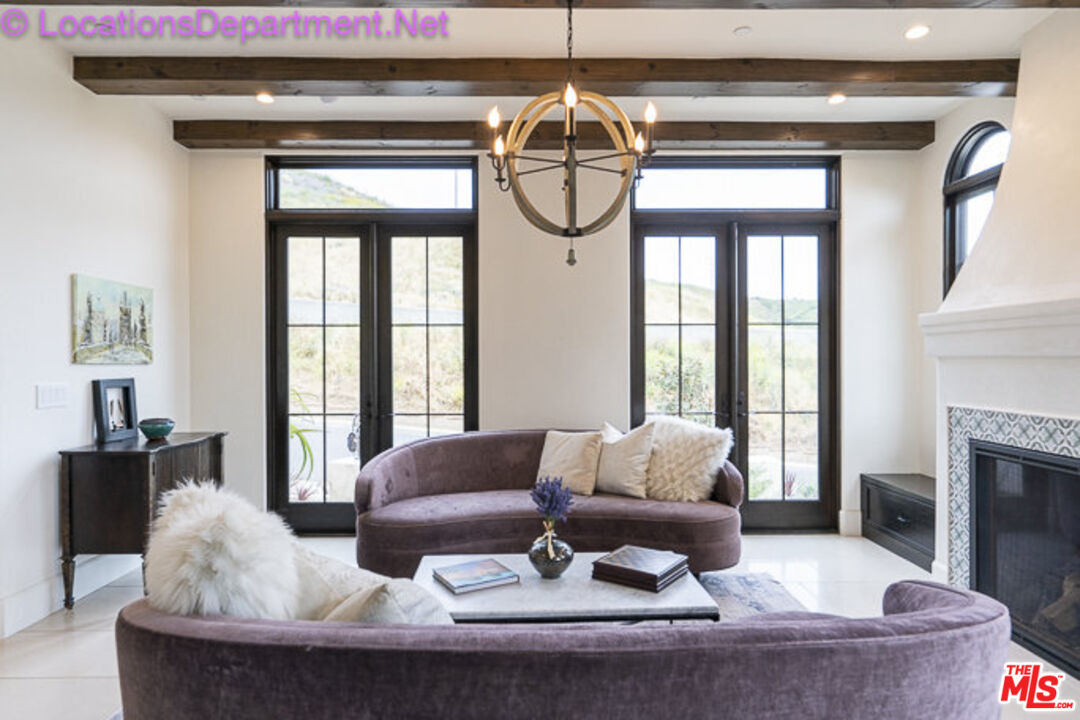 5861 Ridgebrook Drive Agoura Hills, CA 91301 - Photo 17 of 42 a living room with furniture and a large window
