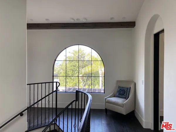 a view of a livingroom with furniture and a window