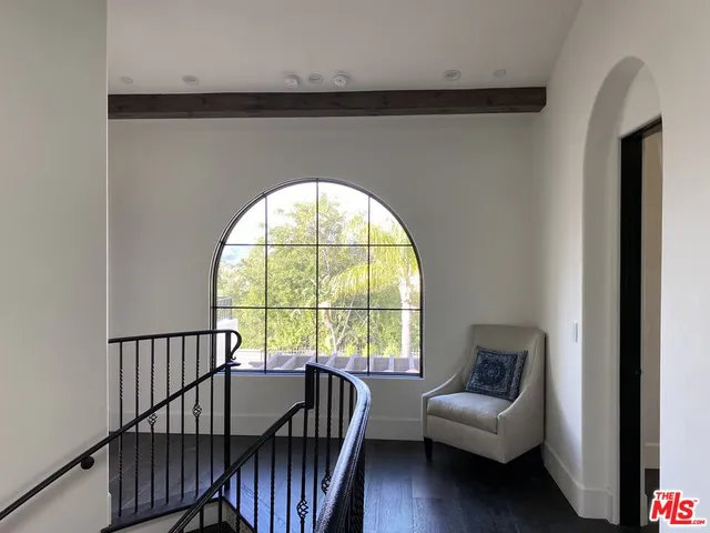 a view of a livingroom with furniture and a window