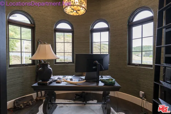 a living room with furniture and window