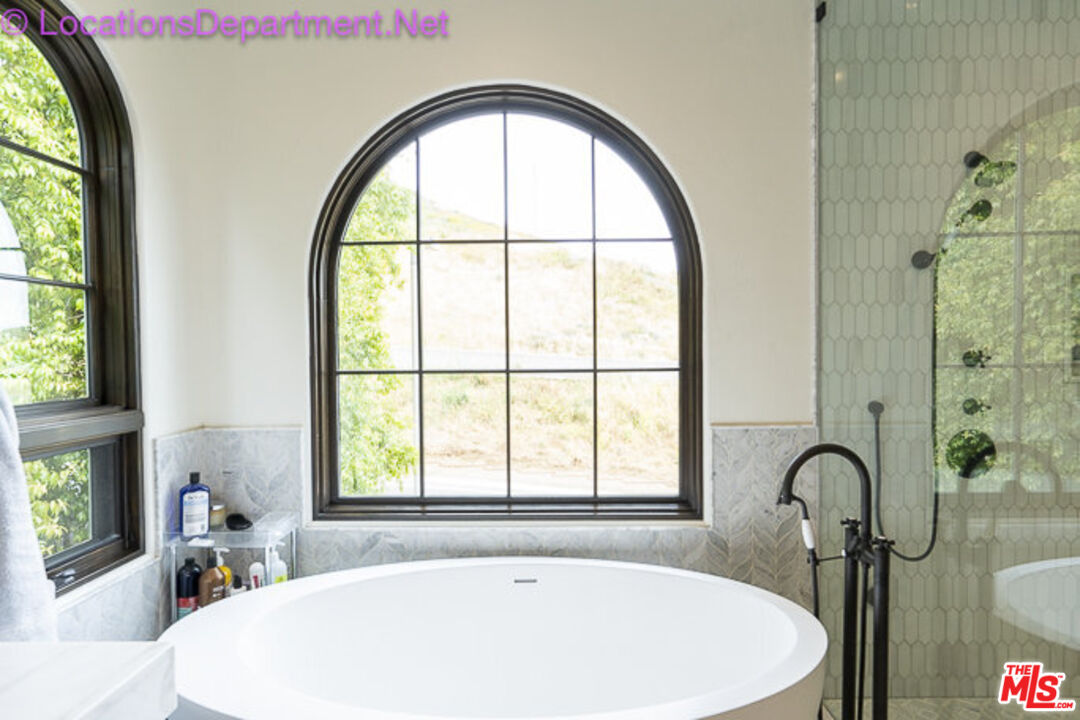 5861 Ridgebrook Drive Agoura Hills, CA 91301 - Photo 26 of 42 a white bath tub sitting next to a window