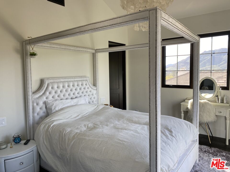 5861 Ridgebrook Drive Agoura Hills, CA 91301 - Photo 28 of 42 a bedroom with a bed and a window