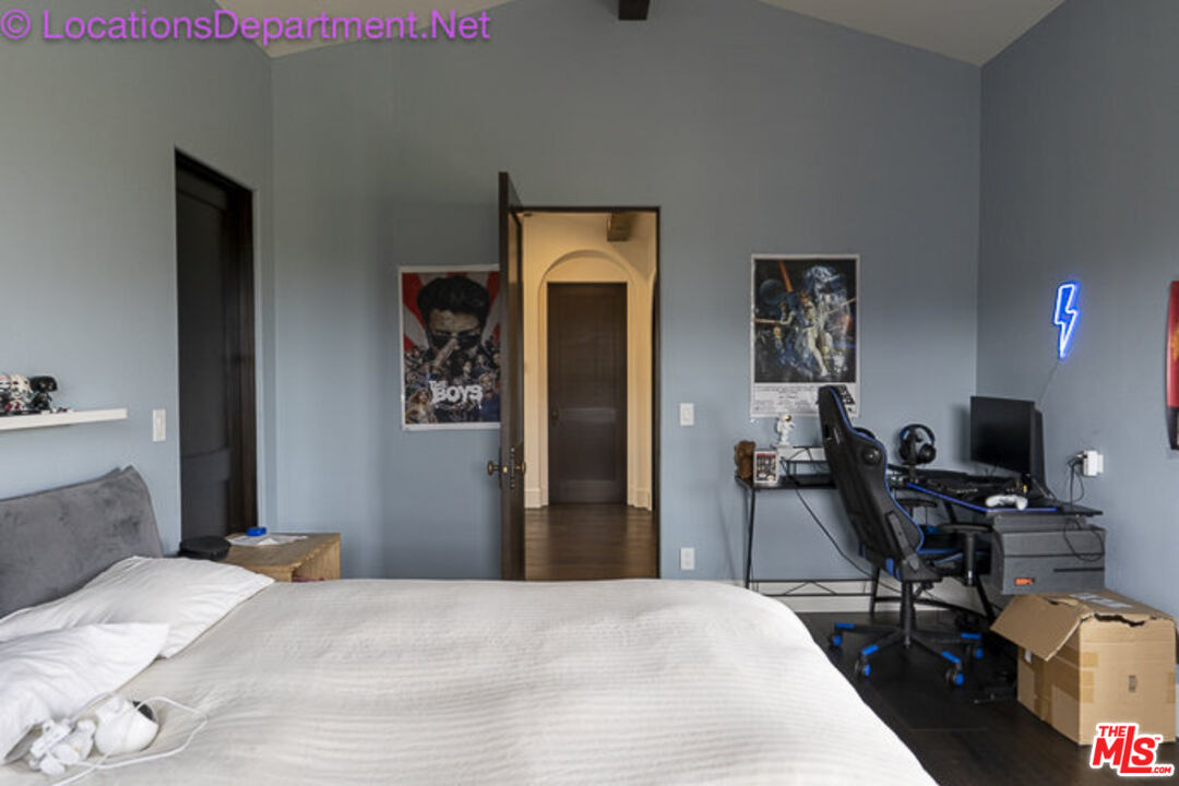 5861 Ridgebrook Drive Agoura Hills, CA 91301 - Photo 30 of 42 a bedroom with a bed and a computer on a table