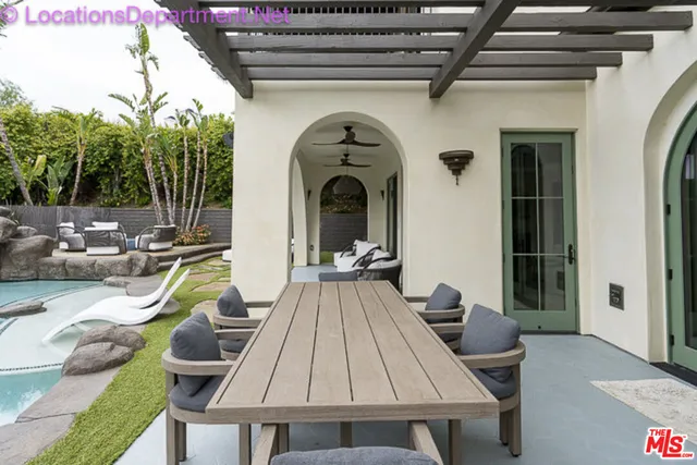 a view of swimming pool with outdoor seating and stairs