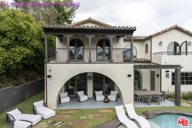 a front view of a house with swimming pool