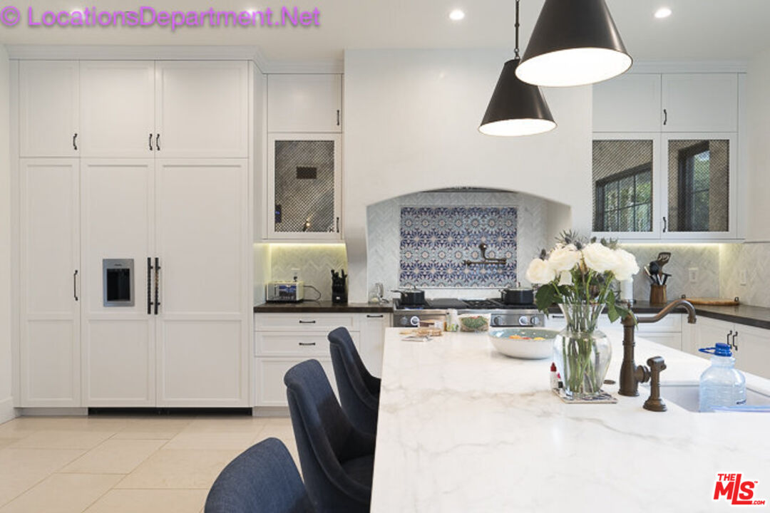5861 Ridgebrook Drive Agoura Hills, CA 91301 - Photo 9 of 42 a living room with furniture and a chandelier