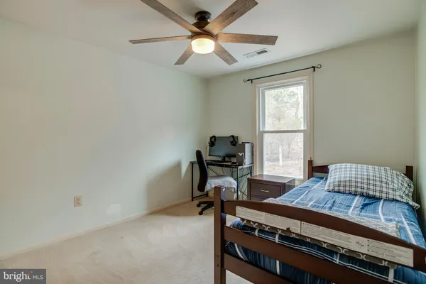 a bedroom with a bed and furniture