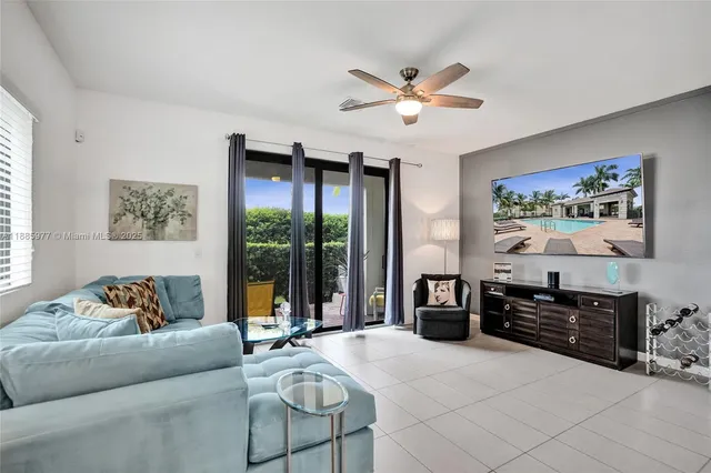 a view of a livingroom with furniture and a flat screen tv
