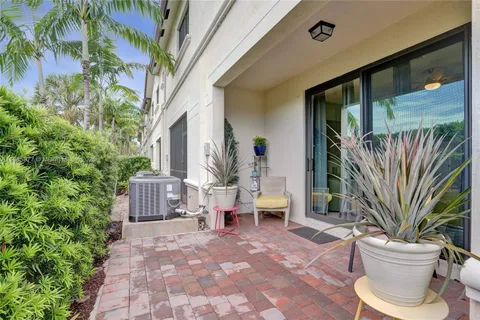 a spacious bathroom with a double vanity sink a toilet a shower and a mirror