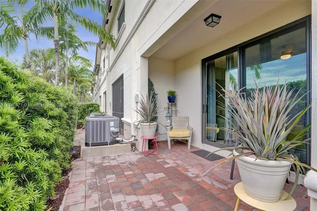 a spacious bathroom with a double vanity sink a toilet a shower and a mirror