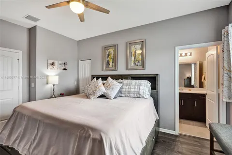 a bedroom with a bed and a table