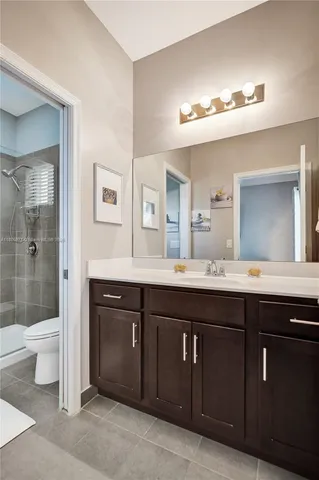 a bathroom with a sink a toilet and tub