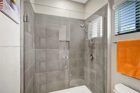 a bathroom with a sink a toilet and bathtub