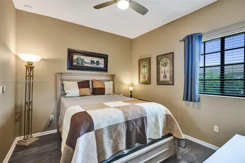 a view of room with furniture and wooden floor