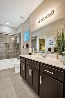 a view of swimming pool with outdoor seating and lake view