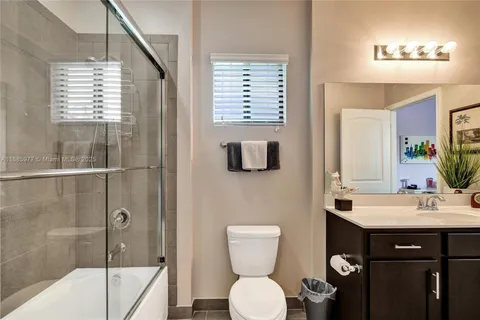 a view of a house with swimming pool and sitting area