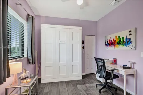 a view of outdoor space with garden and trees