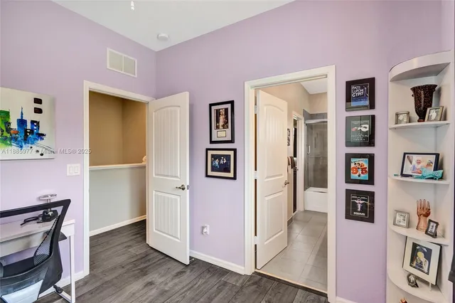 a picture of a bench in front of a wall