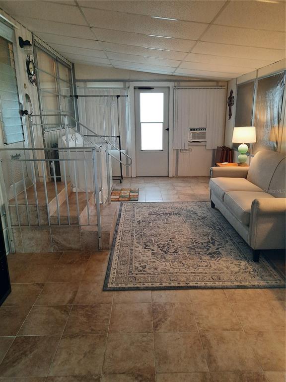 4 Palm Place Tavares, FL 32778 - Photo 12 of 20 a living room with a couch and a rug