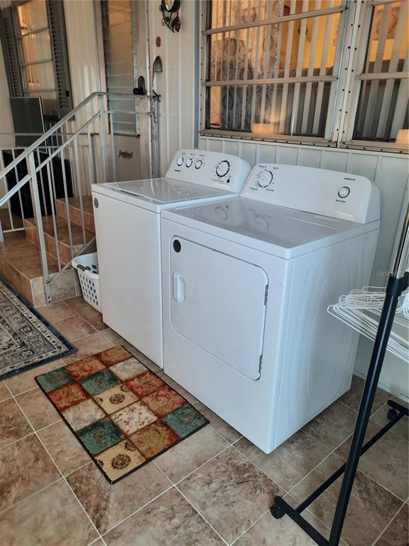 4 Palm Place Tavares, FL 32778 - Photo 15 of 20 a utility room with dryer and washer